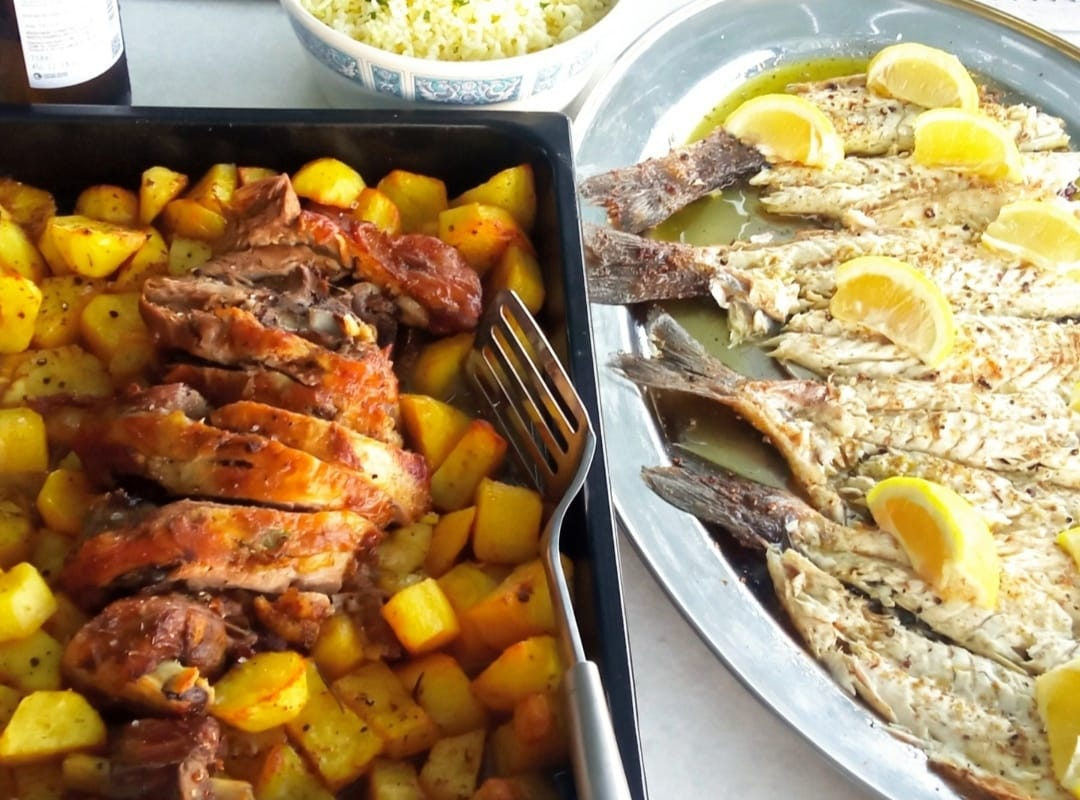 Roast chicken with potatoes and baked fish